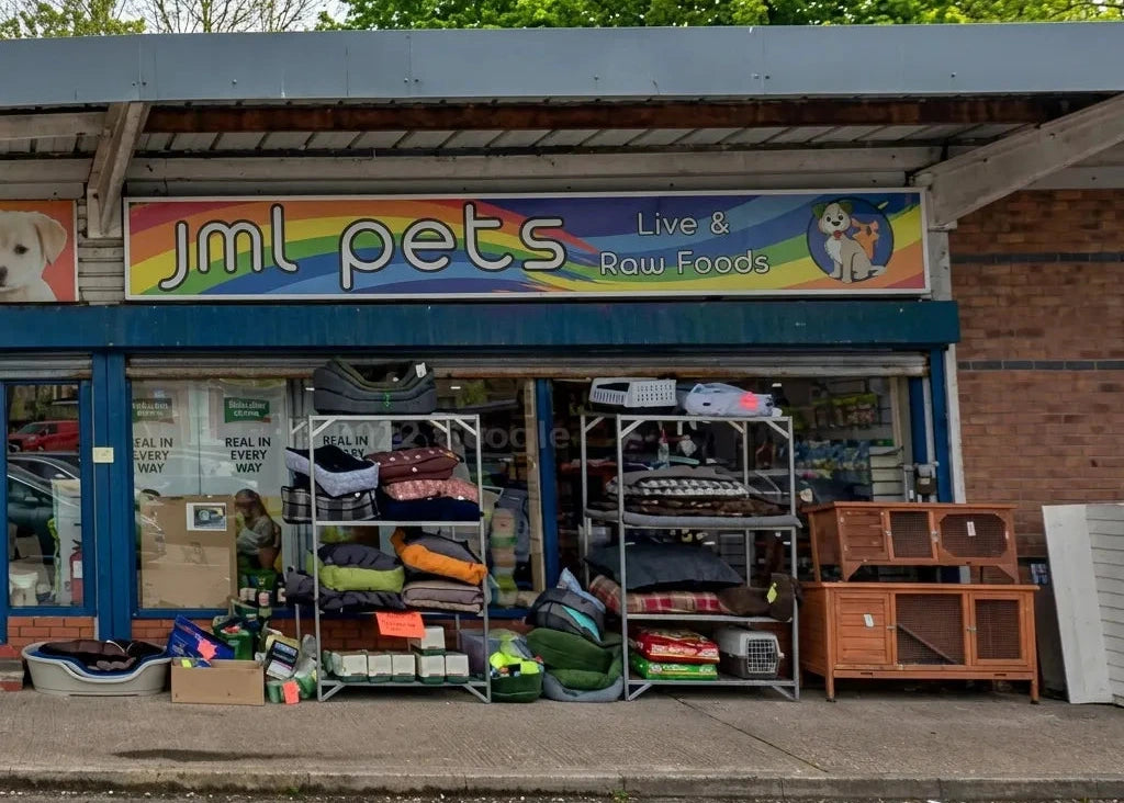 JML Pets store front with pet supplies displayed outside